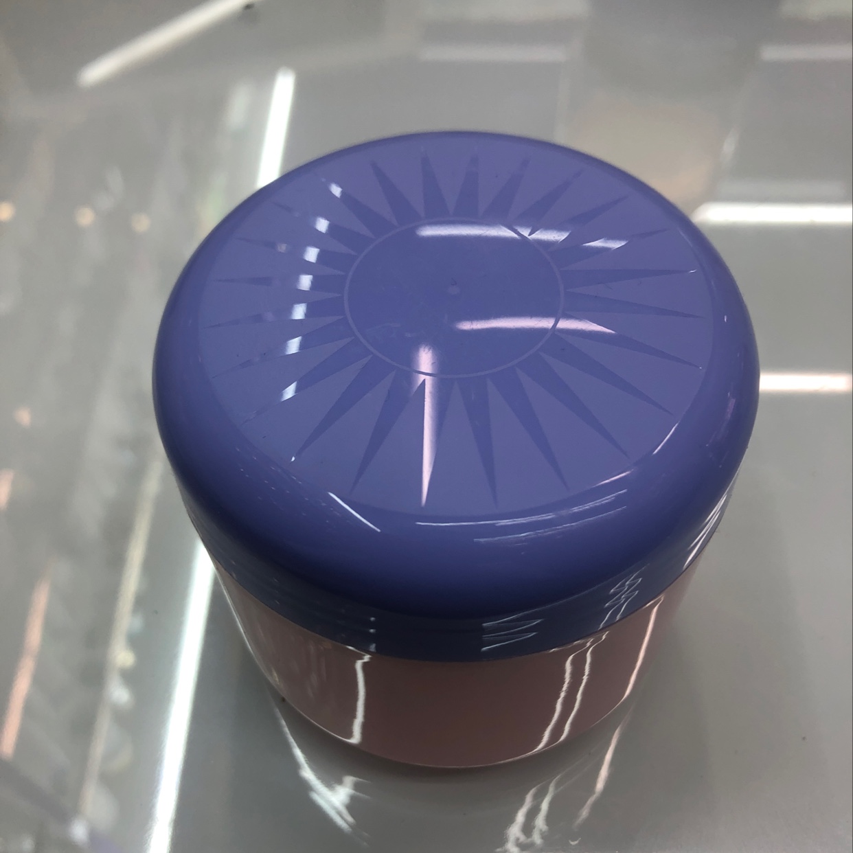 Pink body cream bottle with purple lid thumbnail