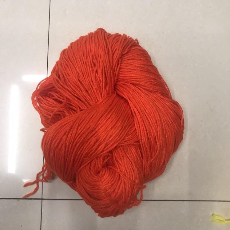 250 grams of bright red wool yarn