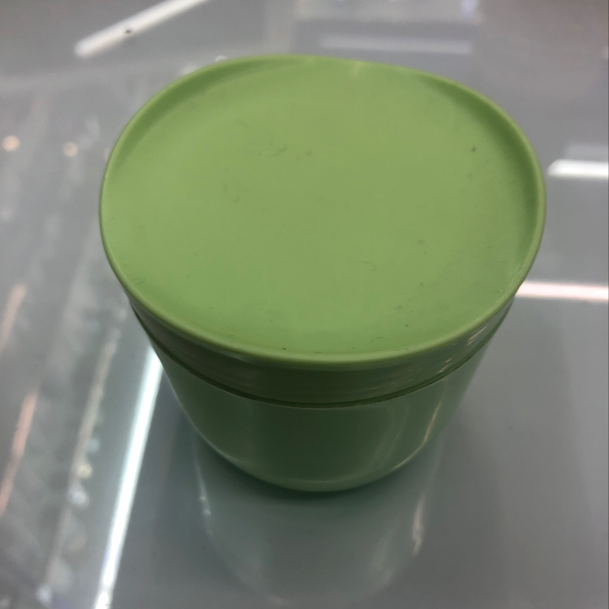 Light green cream bottle