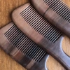 The natural peach wood comb with a handle and fine teeth, made with painting techniques, is an excellent gift for home use Item Picture