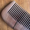 The natural peach wood comb with a handle and fine teeth, made with painting techniques, is an excellent gift for home use undefined