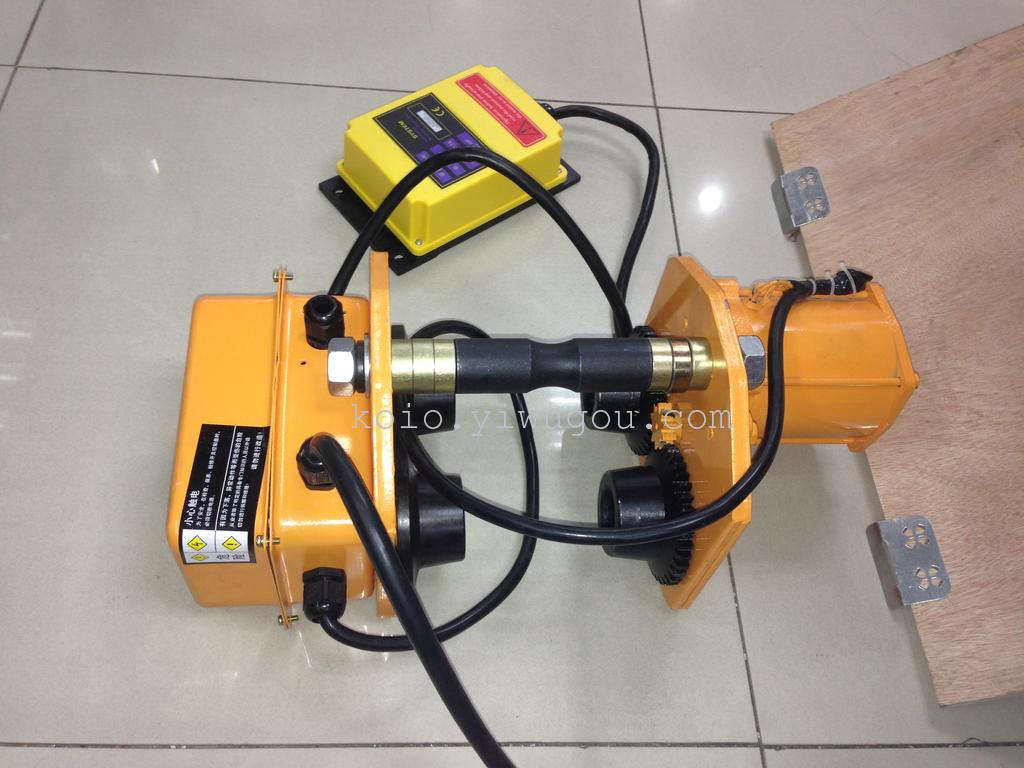 Close-up view of Koio hoist components including gears, wheels, and brake mechanism