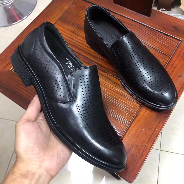 The classic business man kicks off his sandals