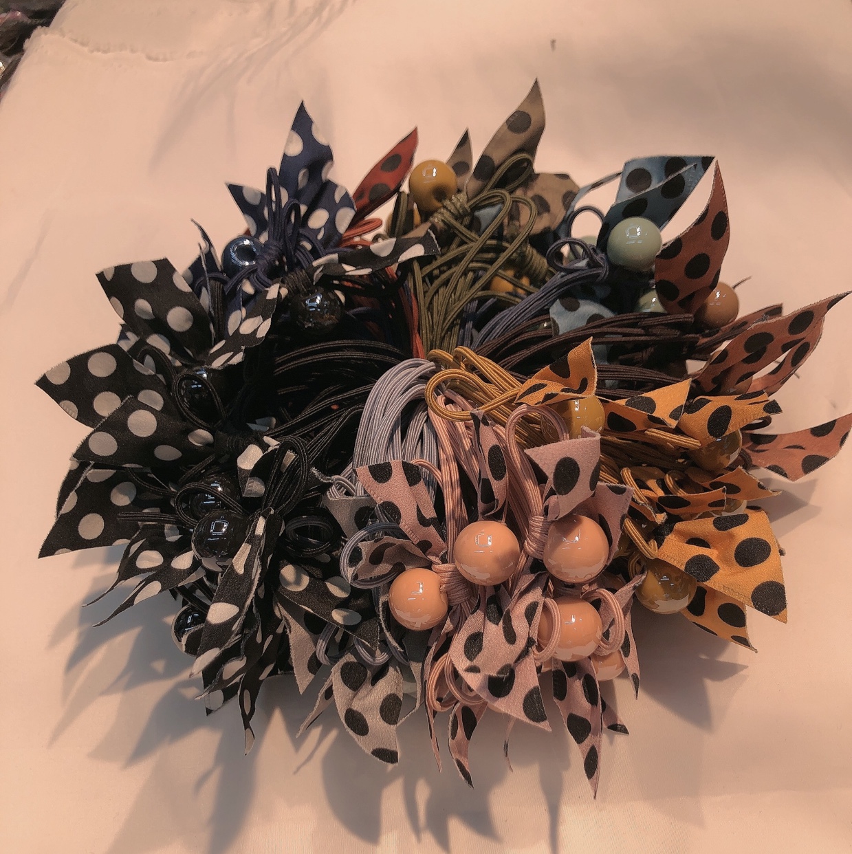 100 hand-tied hair ties with polka dot ribbons, bows and rubber bands in mixed colors for wholesale details Picture