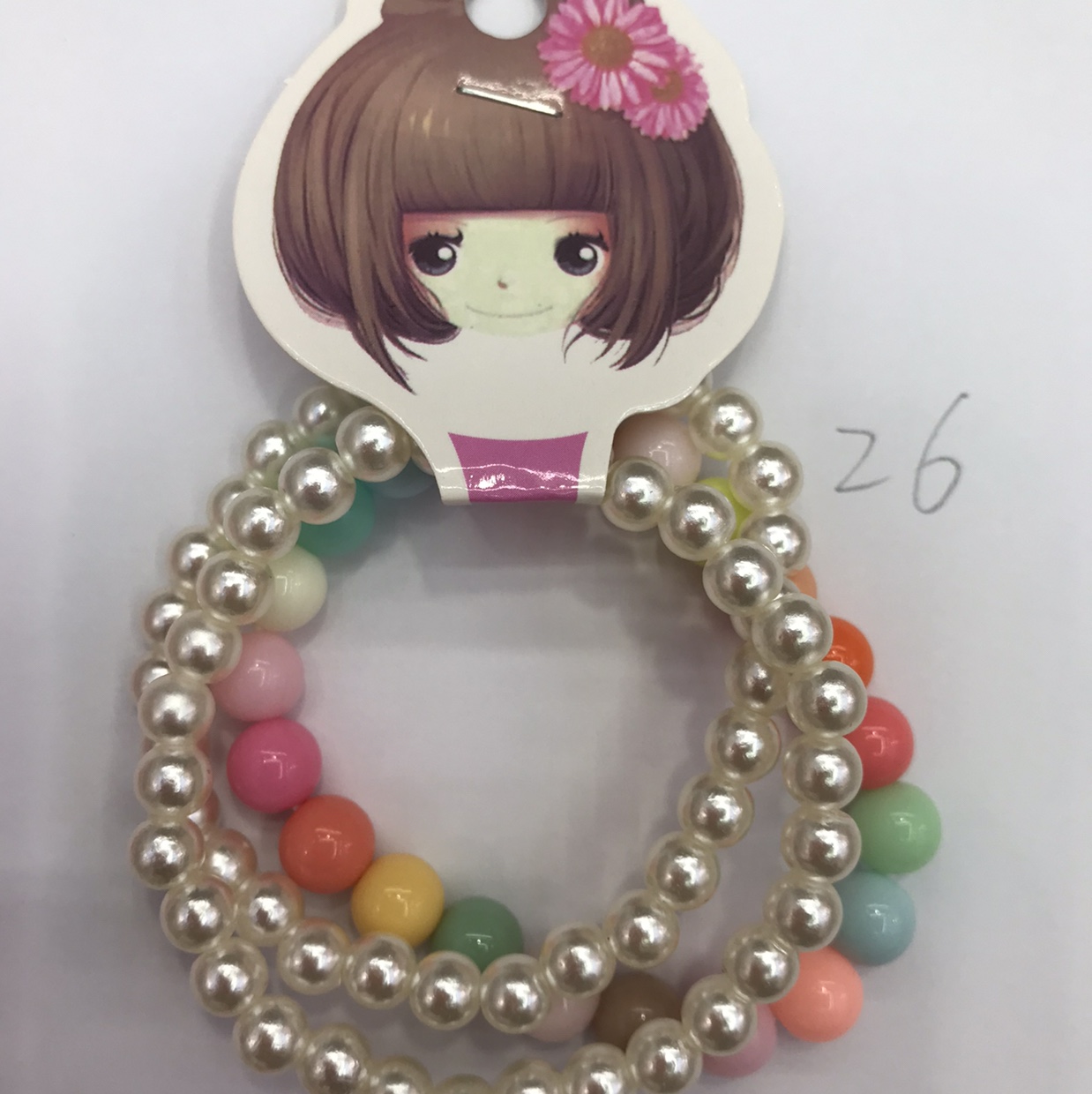 Among the three girls, two of them are small pearls and white. They are 26