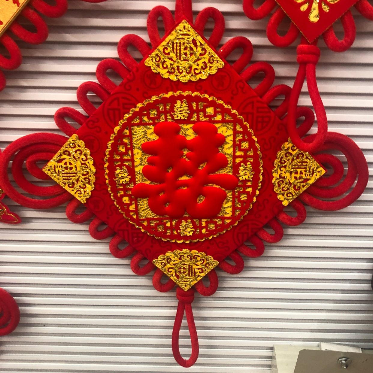 A fish hanging for a Chinese wedding celebration with the character "40 Happiness"