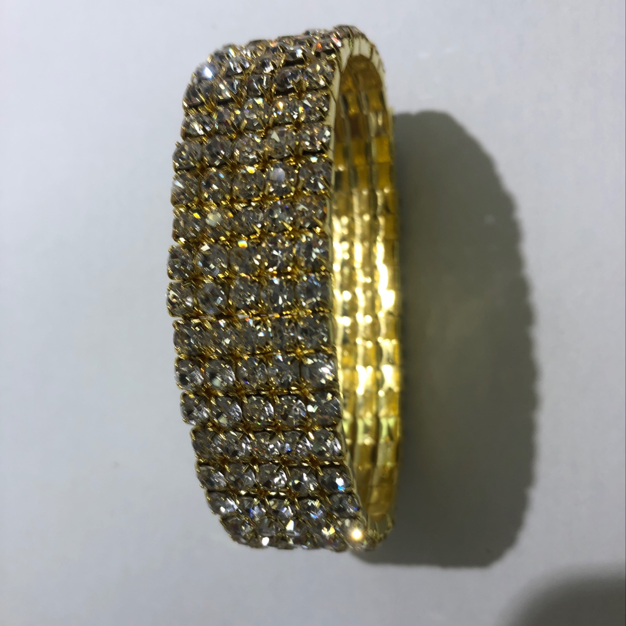 Five rows of gold bracelets