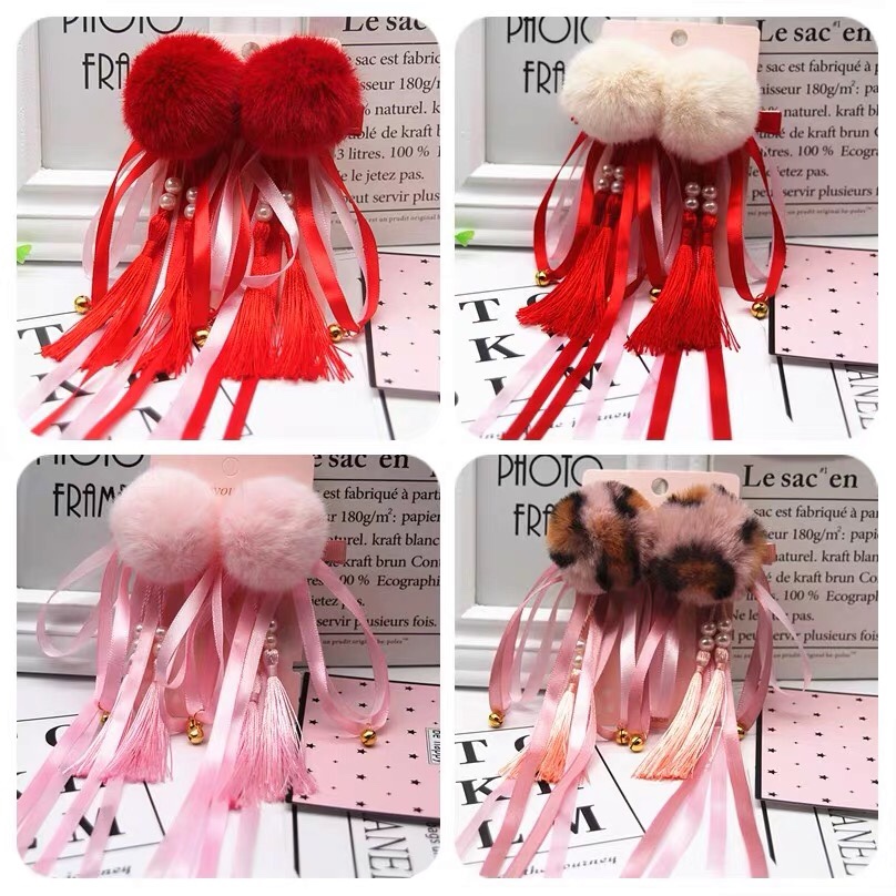 The hairball is pressed by a long ribbon
