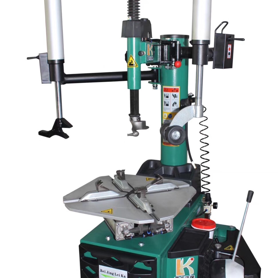 Close-up of 26 inch tire removal machine clamping mechanism