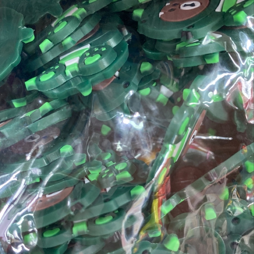 The dark green cute dinosaur bear is a best-selling PVC jewelry accessory