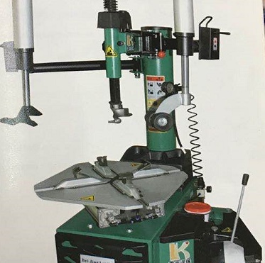 26 inch tire removal machine in professional workshop setting
