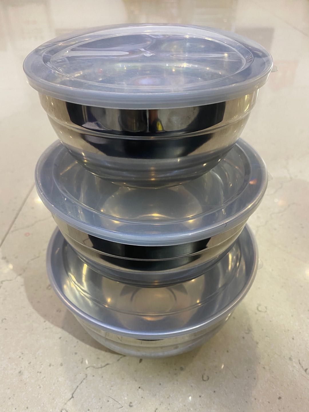A three-piece tupperware lunch box a stainless steel lunch box thumbnail