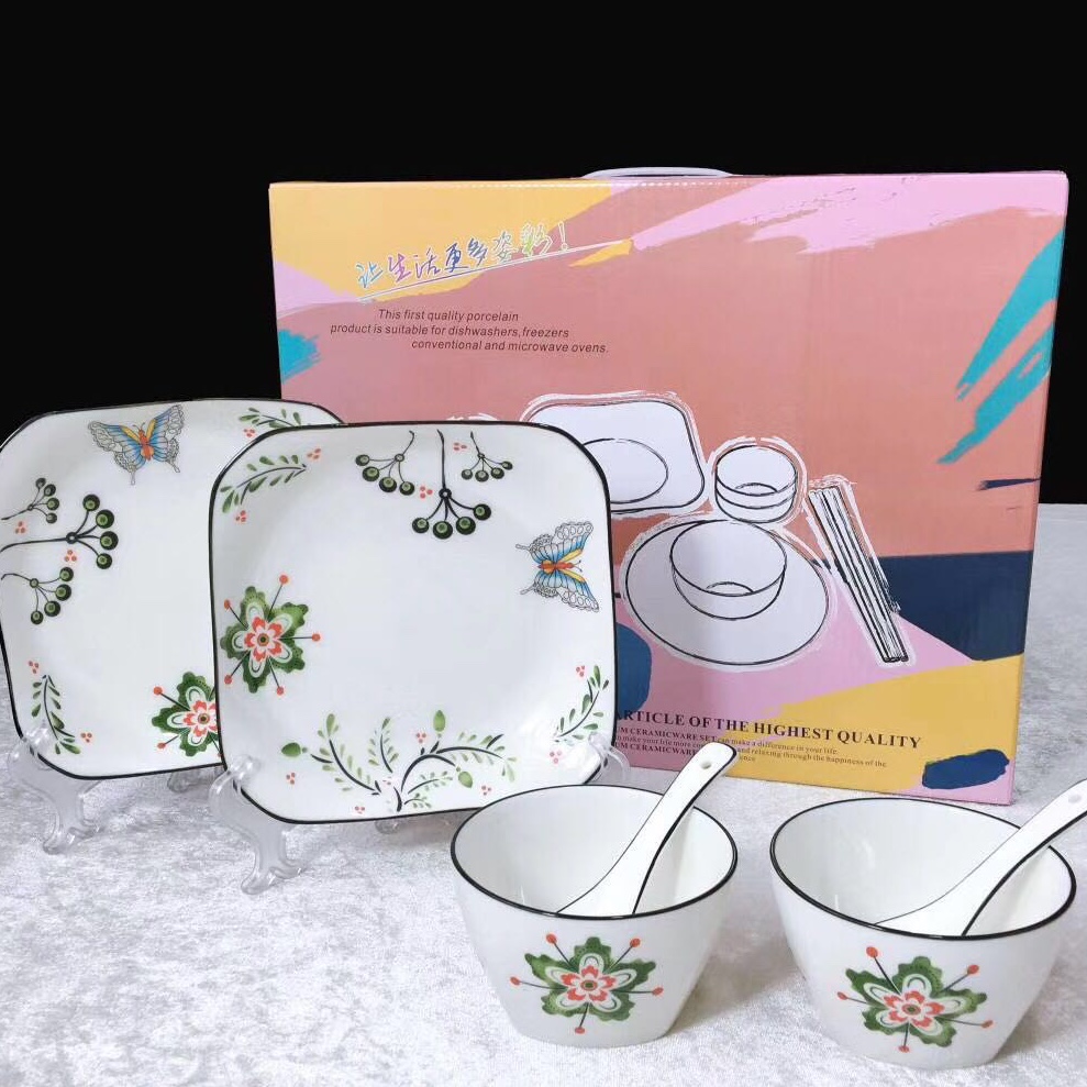 Two bowls, two spoons, two plates undefined