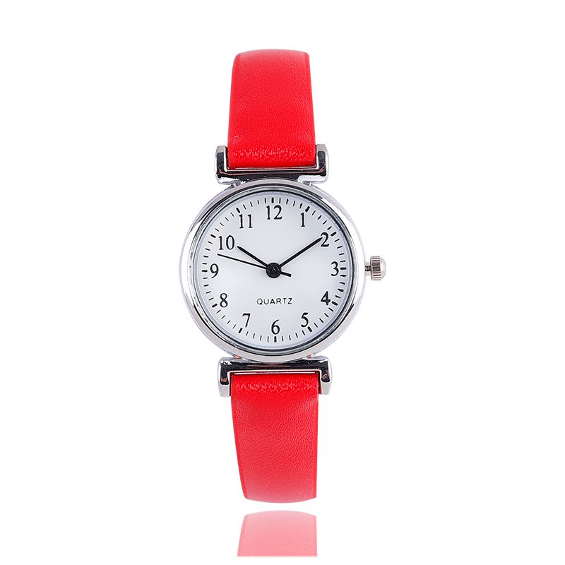 A digital watch with a thin leather strap detail image 4