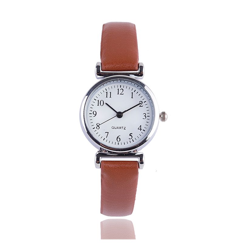 A digital watch with a thin leather strap detail image 6