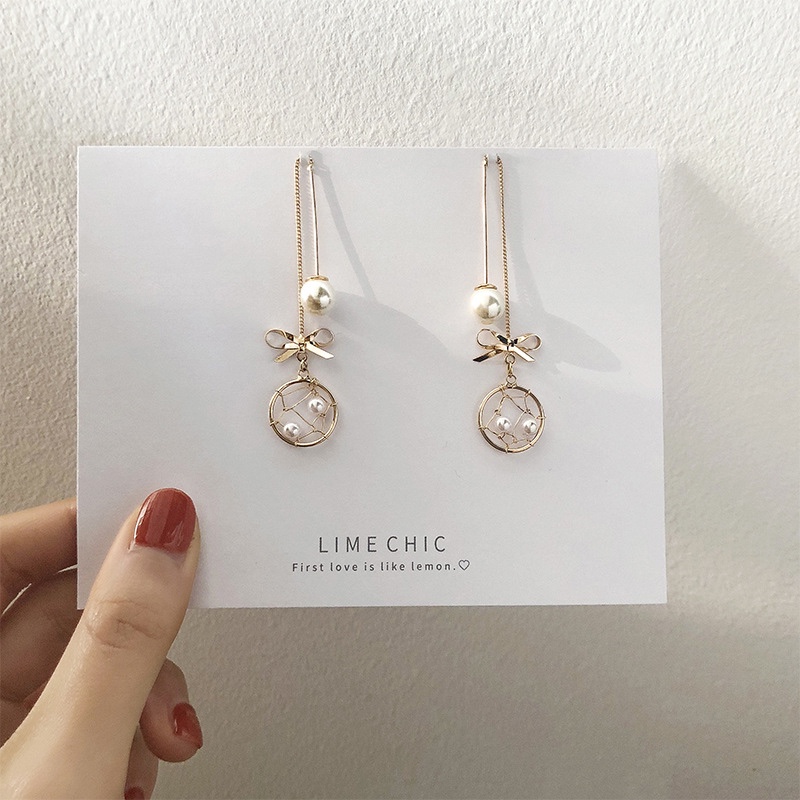 S925 Silver needle bow Dreamcatcher tassel earrings, a female Internet celebrity with an extremely ethereal charm, Korean long pearl earrings with pomelo ears