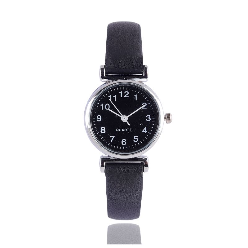 A digital watch with a thin leather strap detail image 5