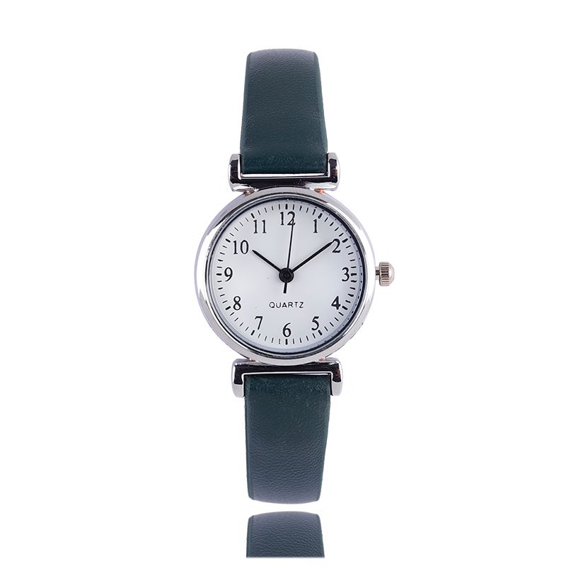 A digital watch with a thin leather strap detail image 7