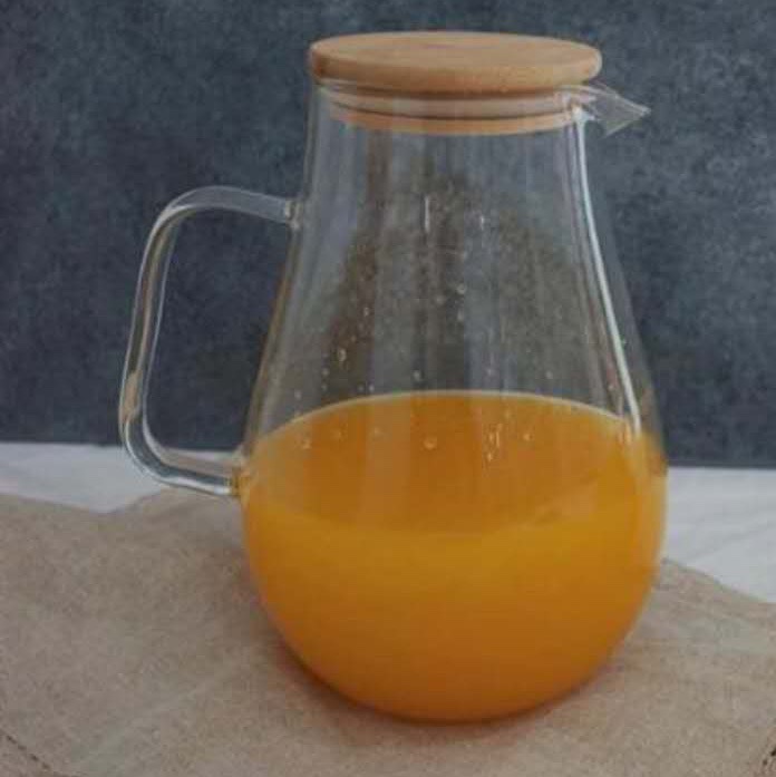 A large cold water bottle with water droplets