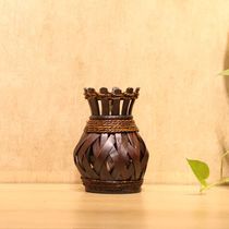 Vintage vases, wooden bamboo plaits, tables, and dry flower containers