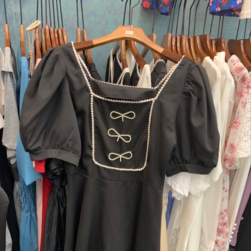 The dress is black