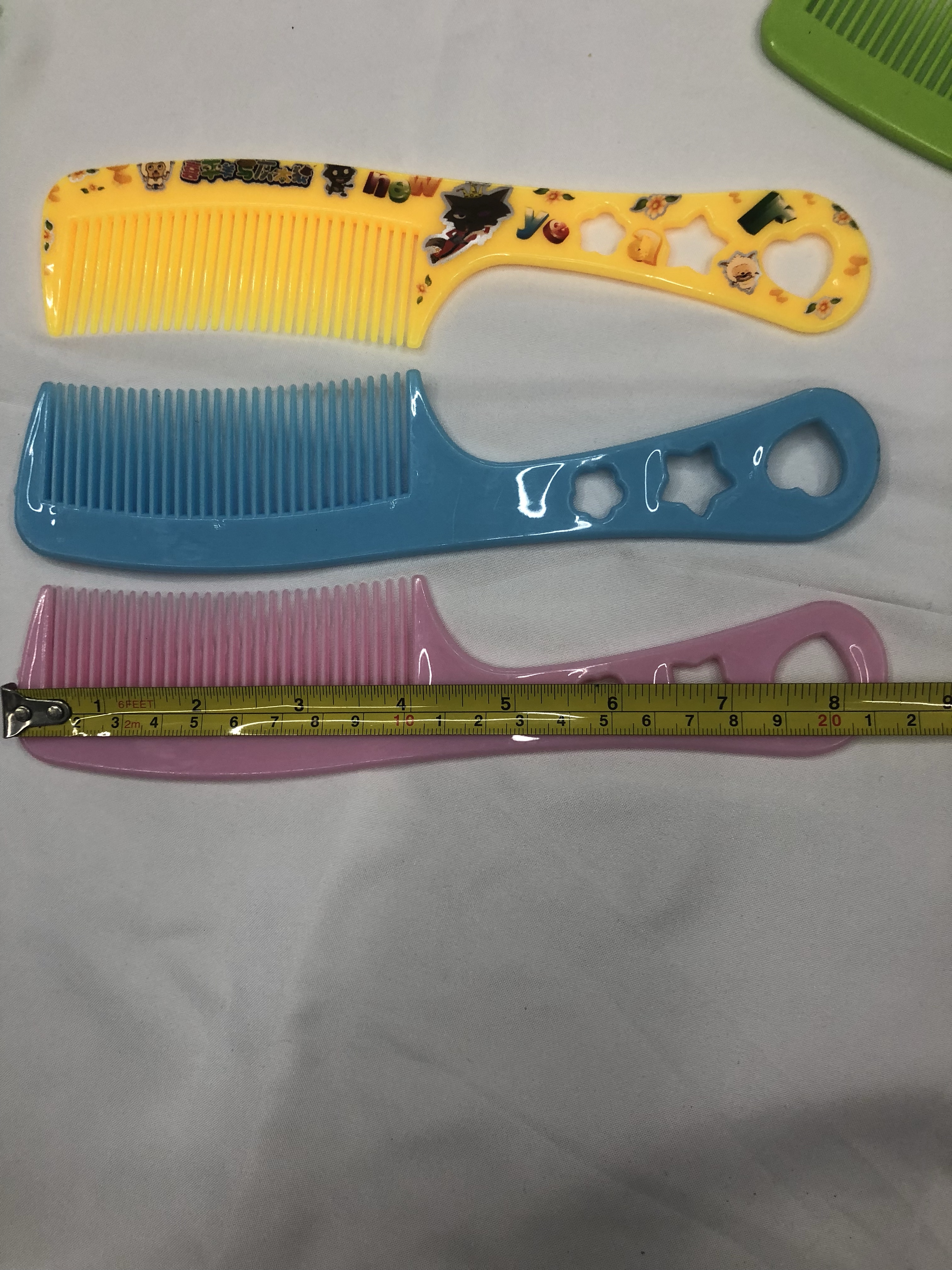 厂家直销63号花包塑料梳子 印花梳子可爱卡通梳子5色混 地摊梳子细节图