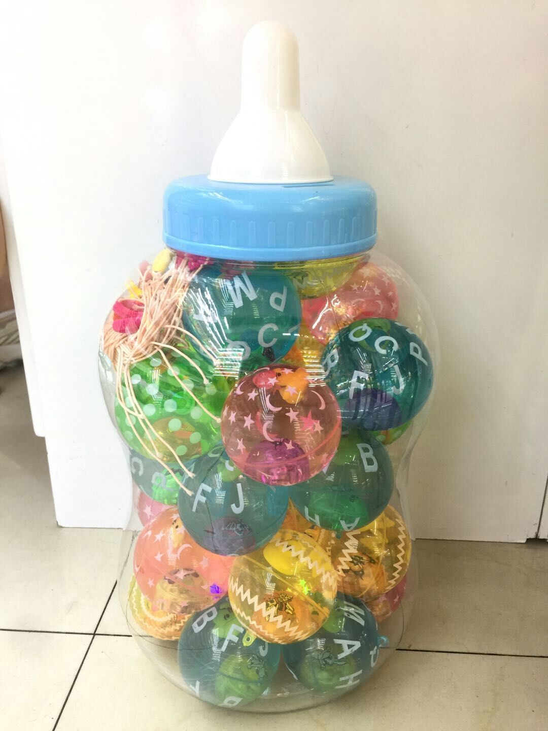 65印花水球带绳奶瓶装