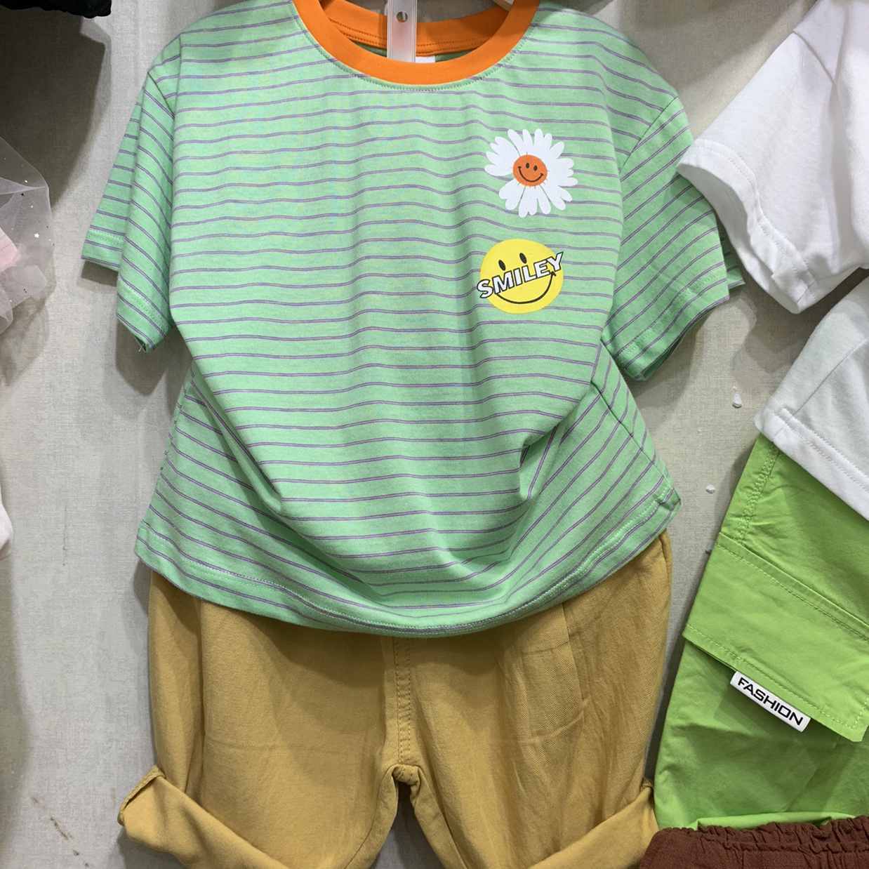 Blue and green striped smiling short-sleeved suit