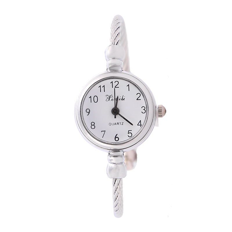 A girl with a watch in an ins style, Korean style, simple and elegant, retro forest style, artistic and fresh, waterproof and petite, middle school girl