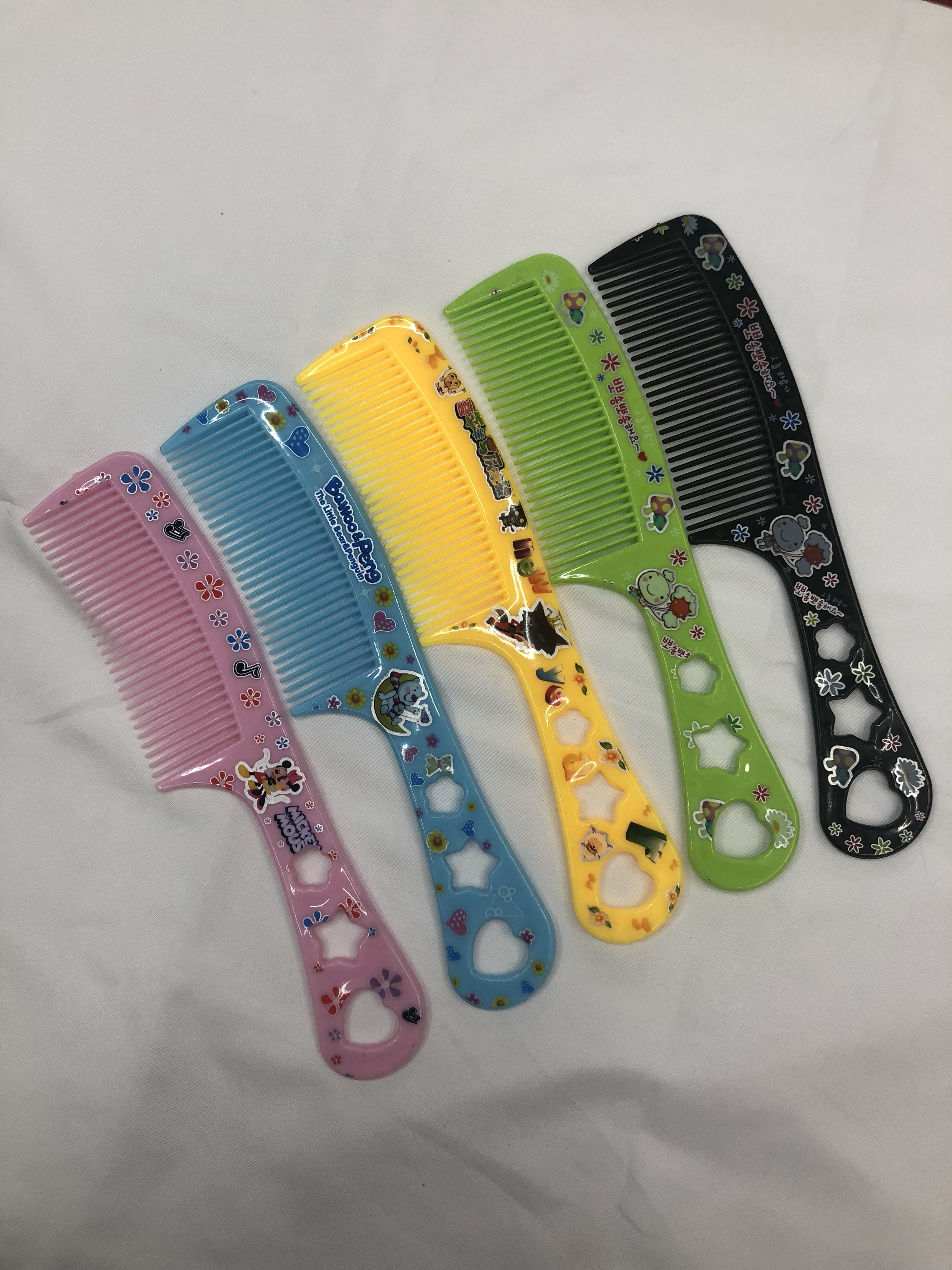 厂家直销63号花包塑料梳子 印花梳子可爱卡通梳子5色混 地摊梳子详情图6