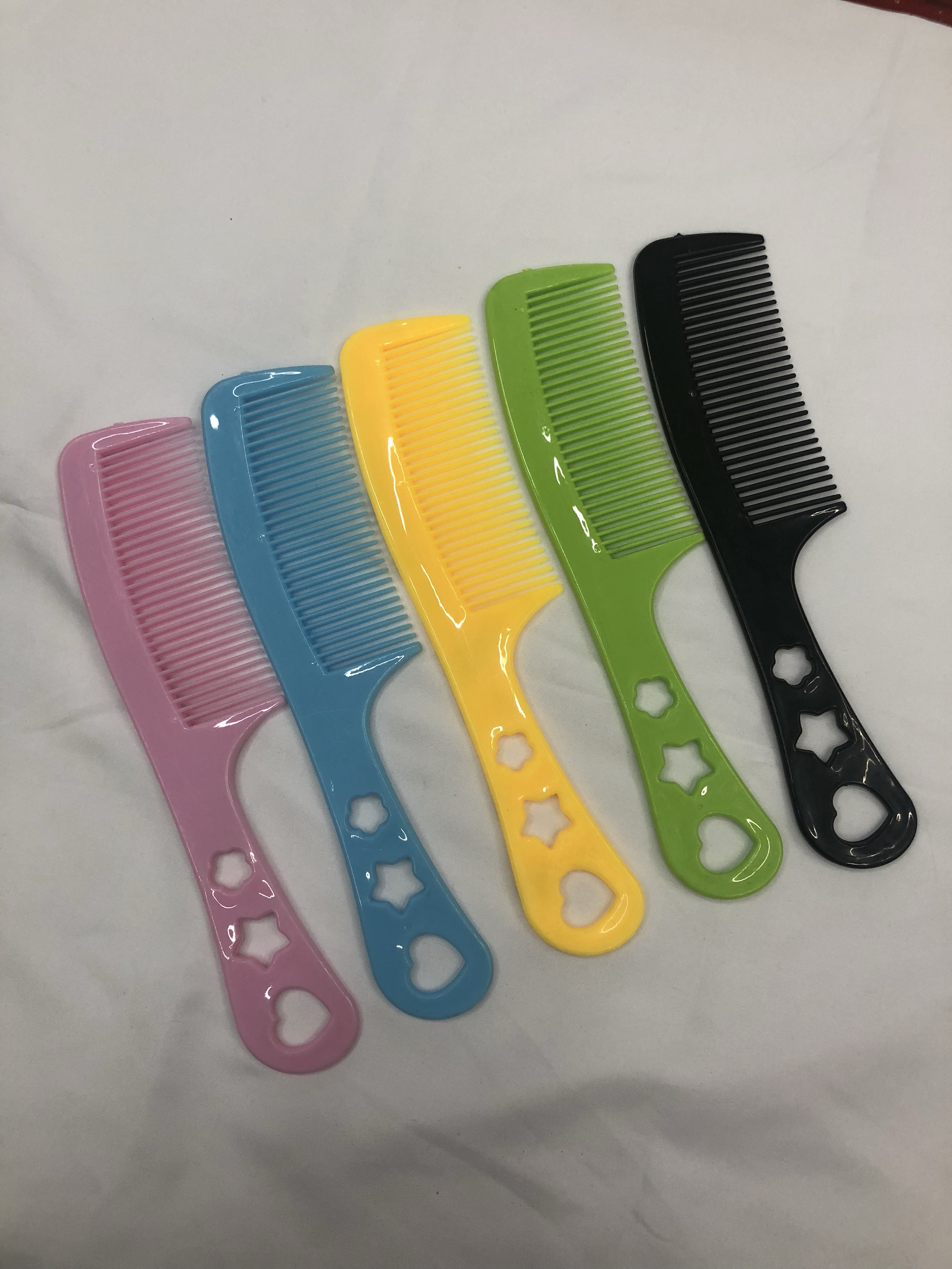 厂家直销63号花包塑料梳子 印花梳子可爱卡通梳子5色混 地摊梳子白底实物图