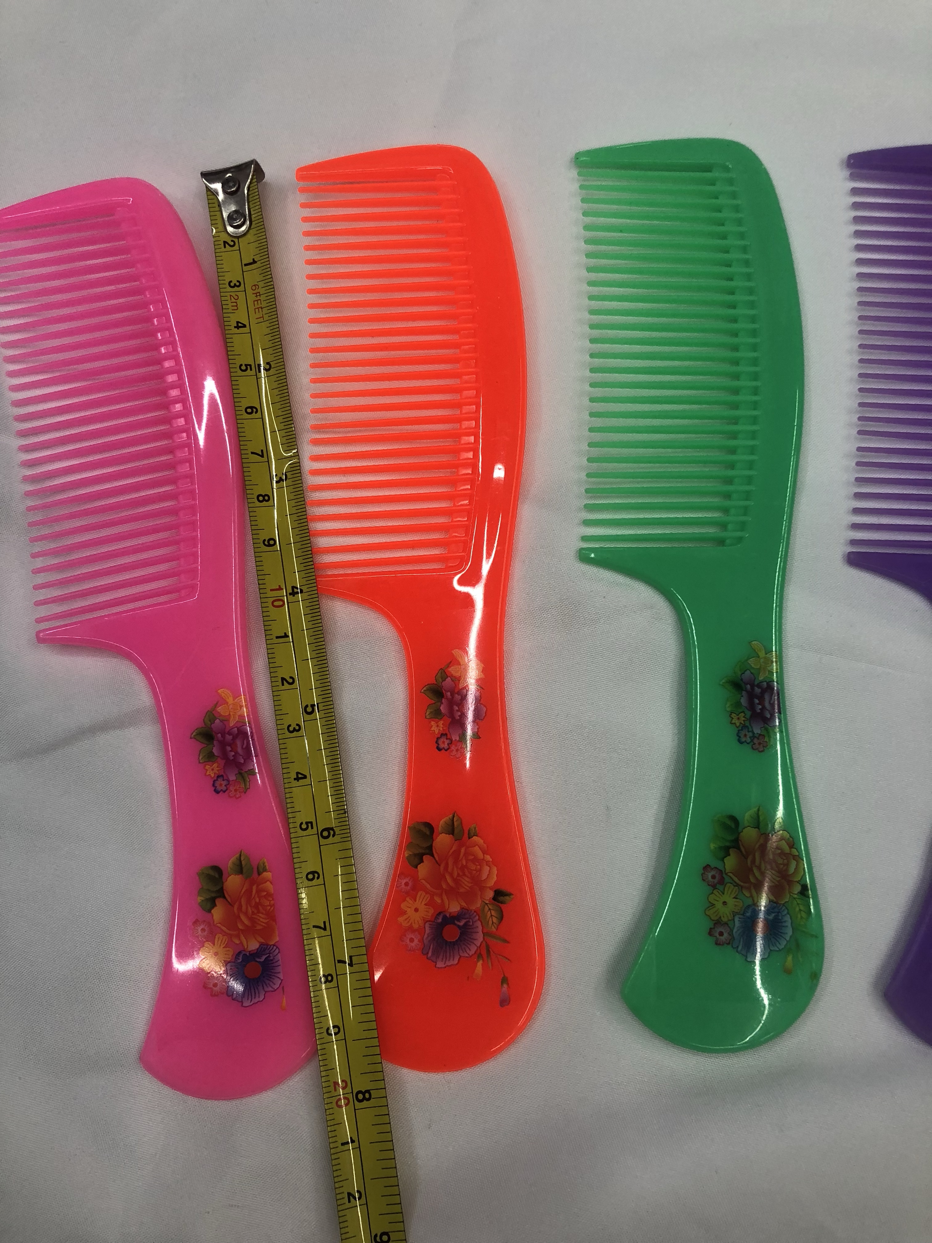 厂家直销印花塑料梳子 地摊热卖梳子 4色果冻色梳子PP材料梳子白底实物图