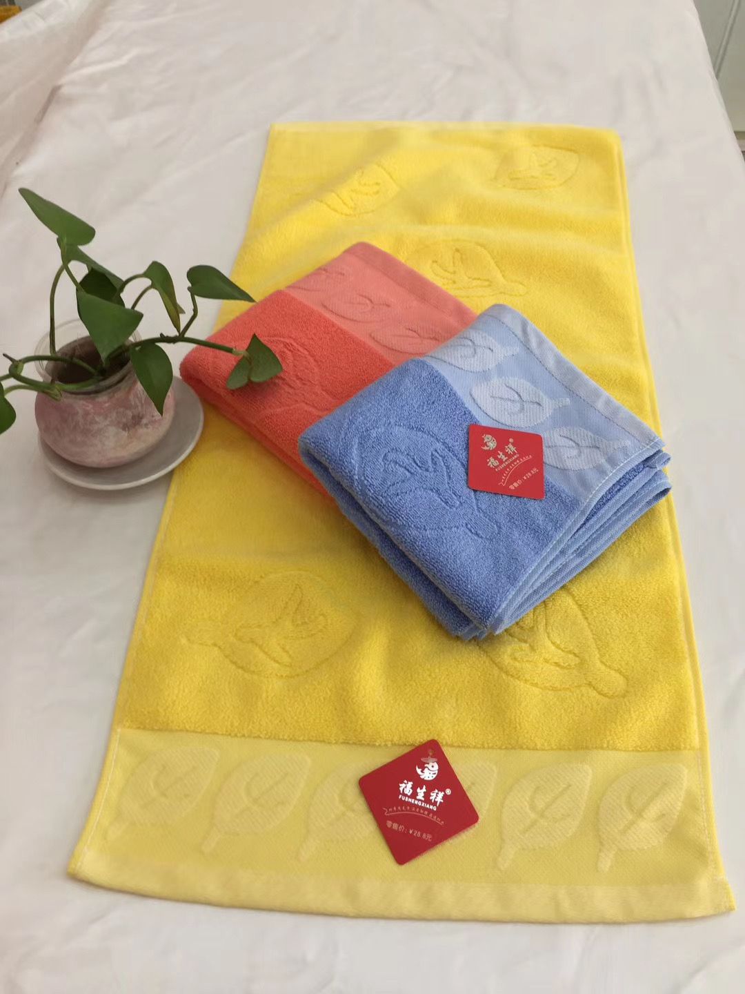 Embossed horizontal strip towel