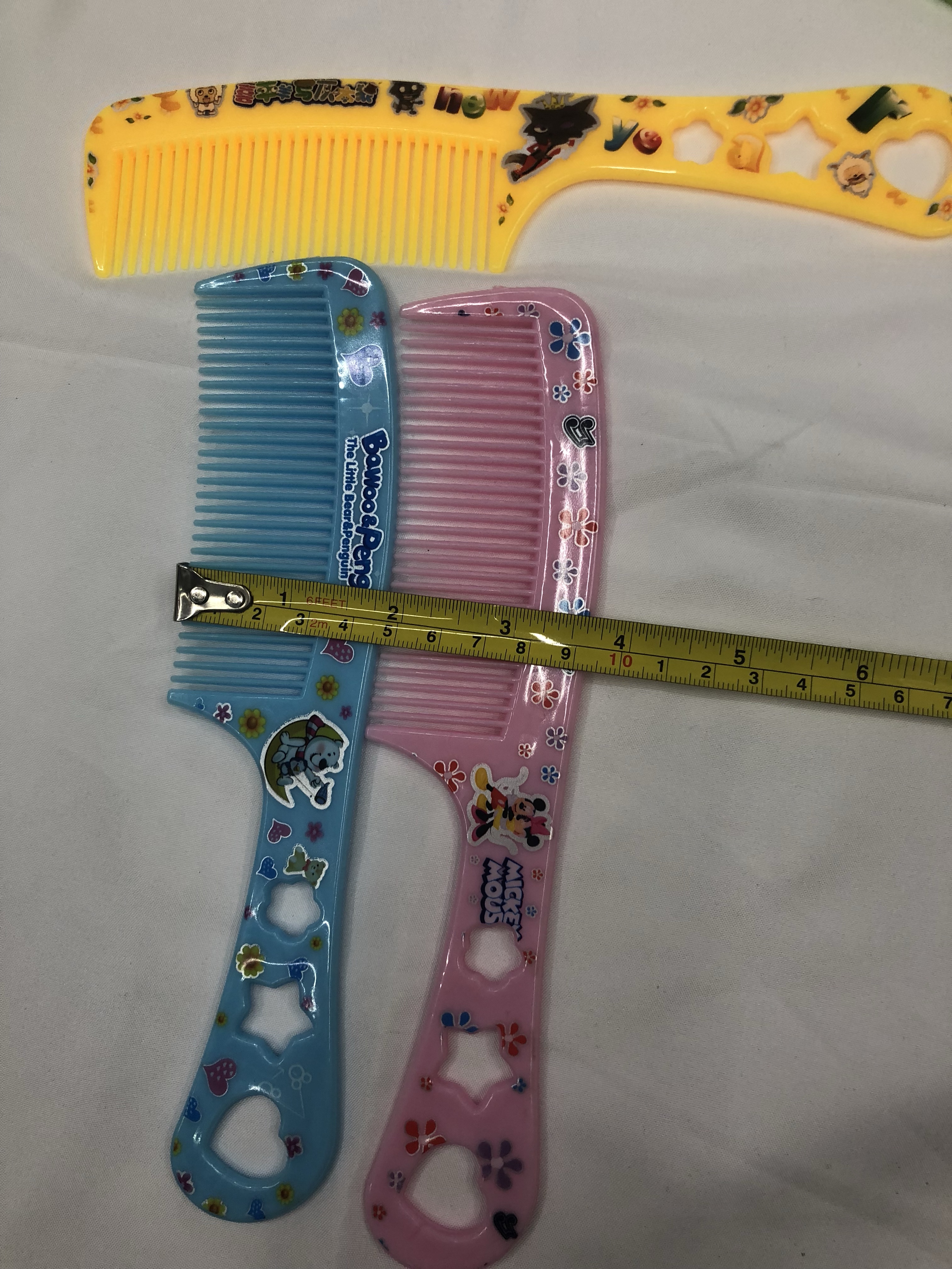 厂家直销63号花包塑料梳子 印花梳子可爱卡通梳子5色混 地摊梳子产品图