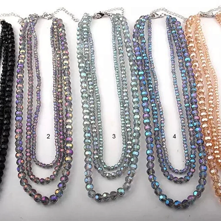 Three layers of necklaces lay along the 049