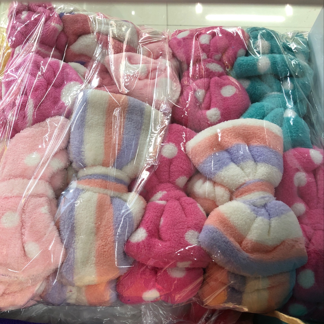 A large printed coral fleece bow headband details Picture