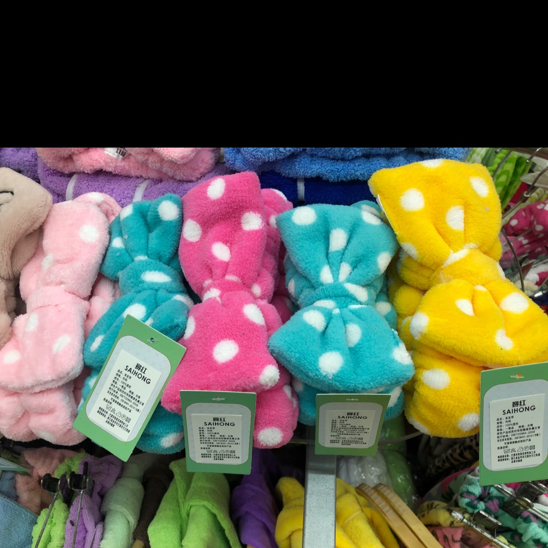 A large printed coral fleece bow headband