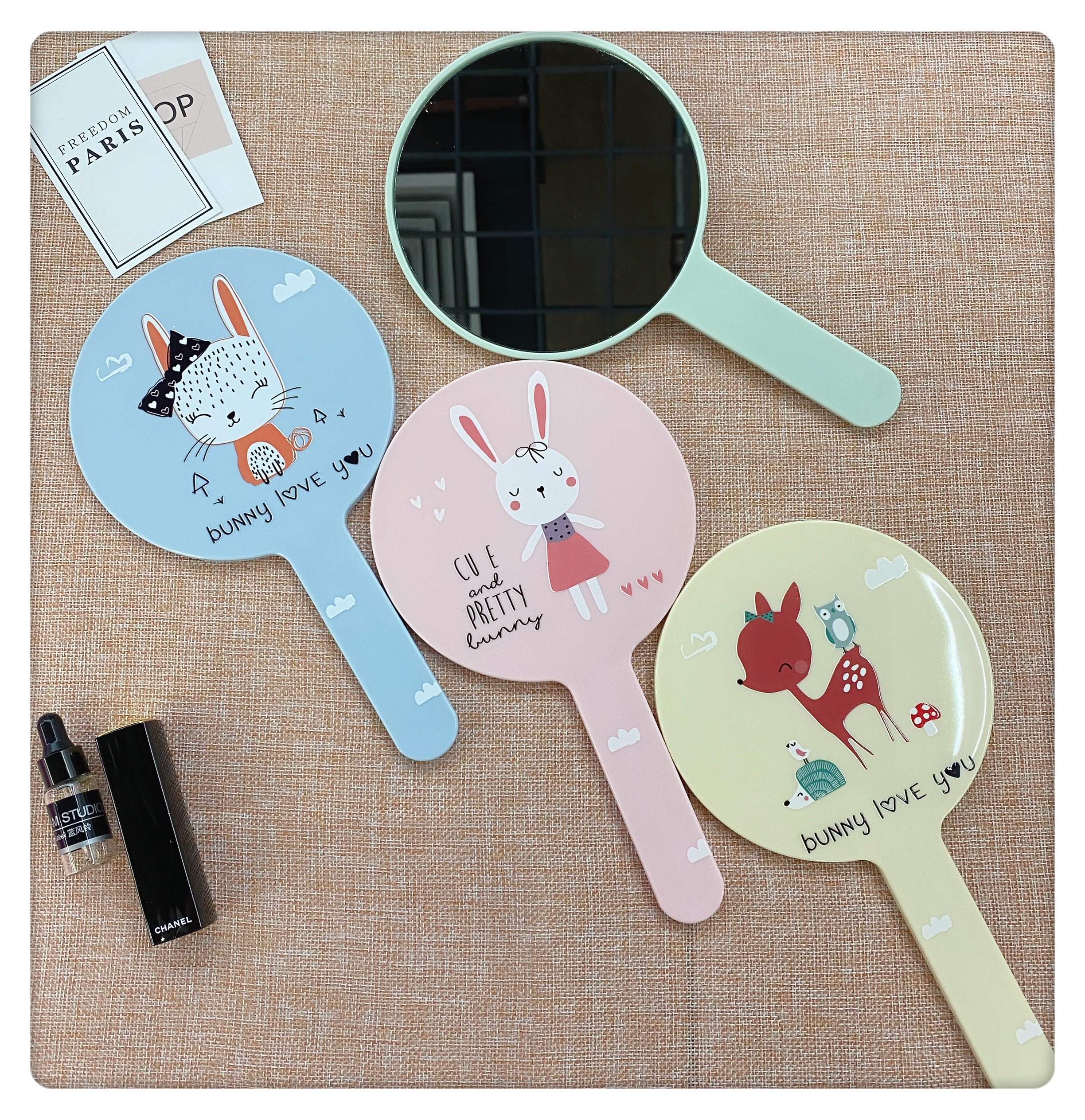 Colorful circular hand-held mirror with painted handle mirror details Picture