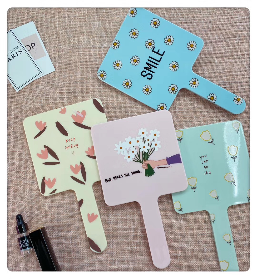 Square-handled makeup mirrors come in a variety of patterns and bright colors details Picture