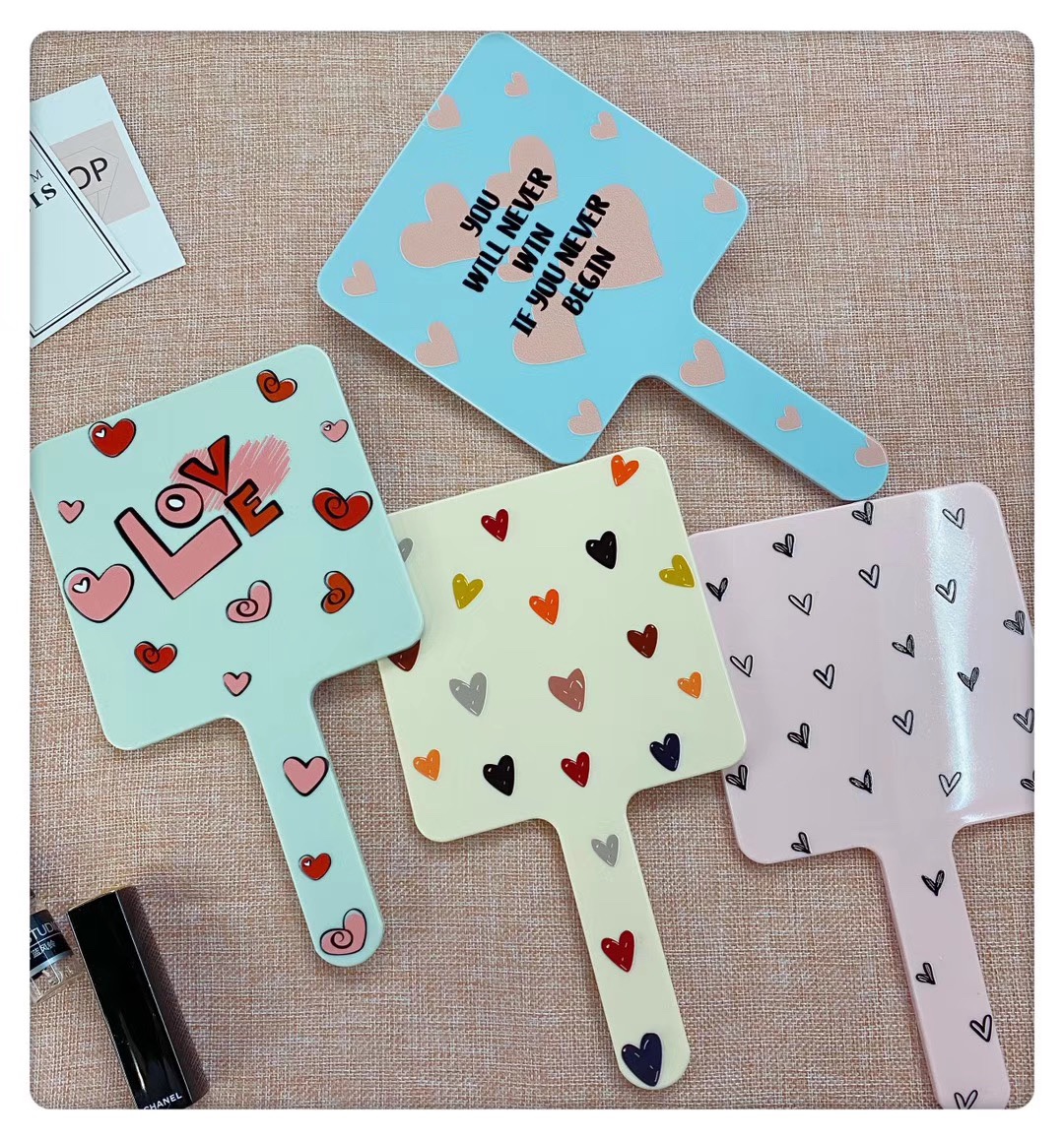 Square-handled makeup mirrors come in a variety of patterns and bright colors Item Picture