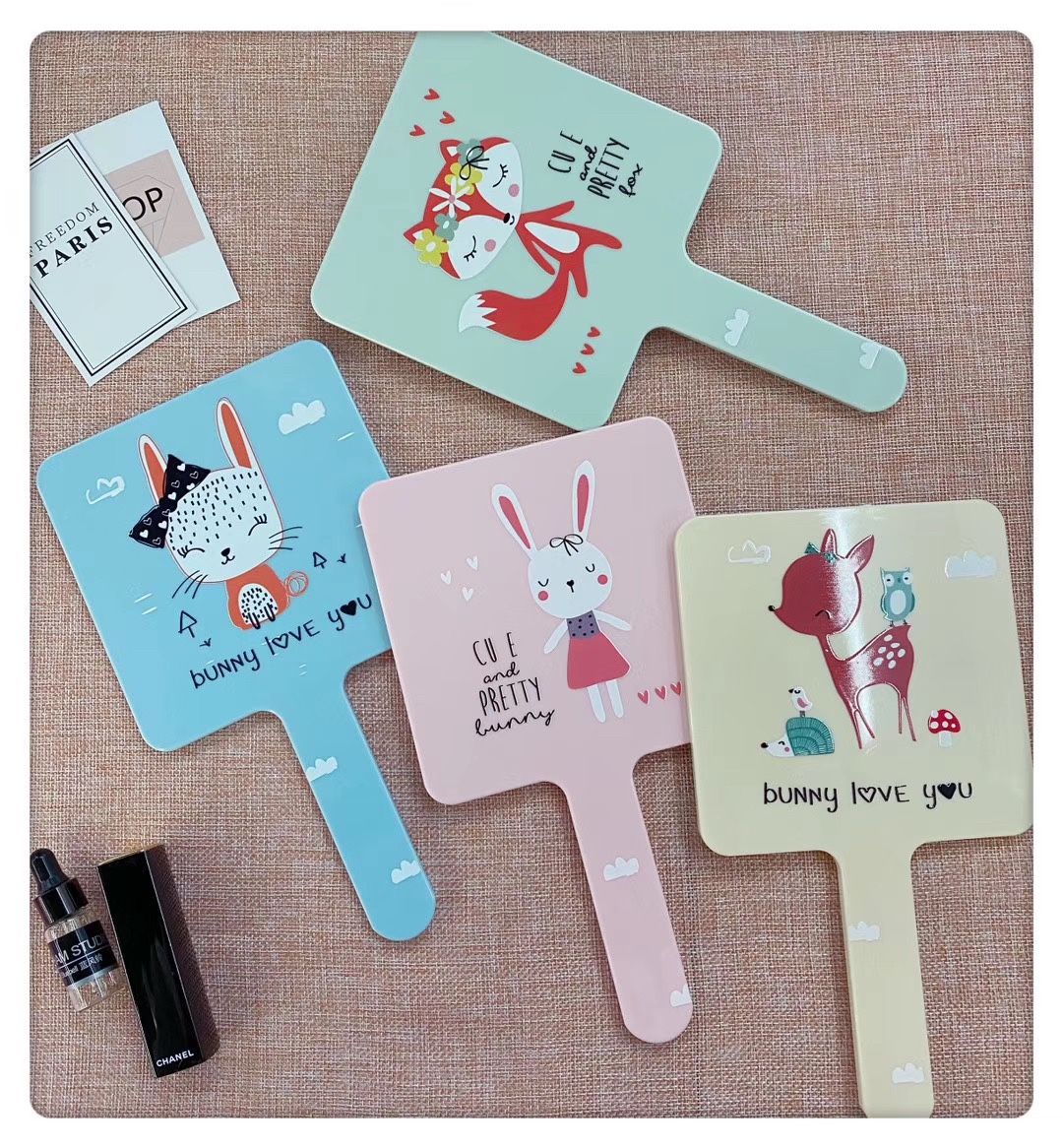 Square-handled makeup mirrors come in a variety of patterns and bright colors undefined