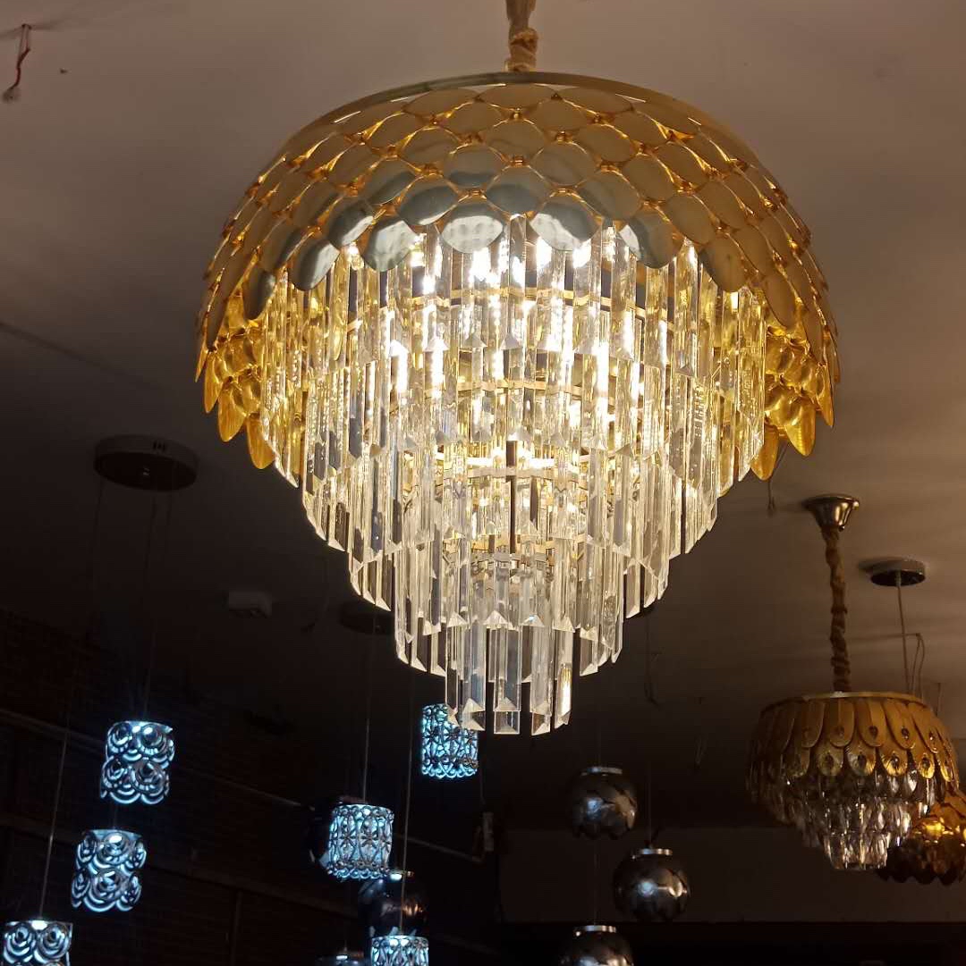 The bedroom is decorated with a crystal chandelier Specification image