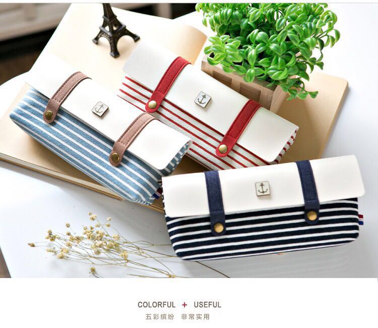 The woman's new striped, high-capacity pencil case