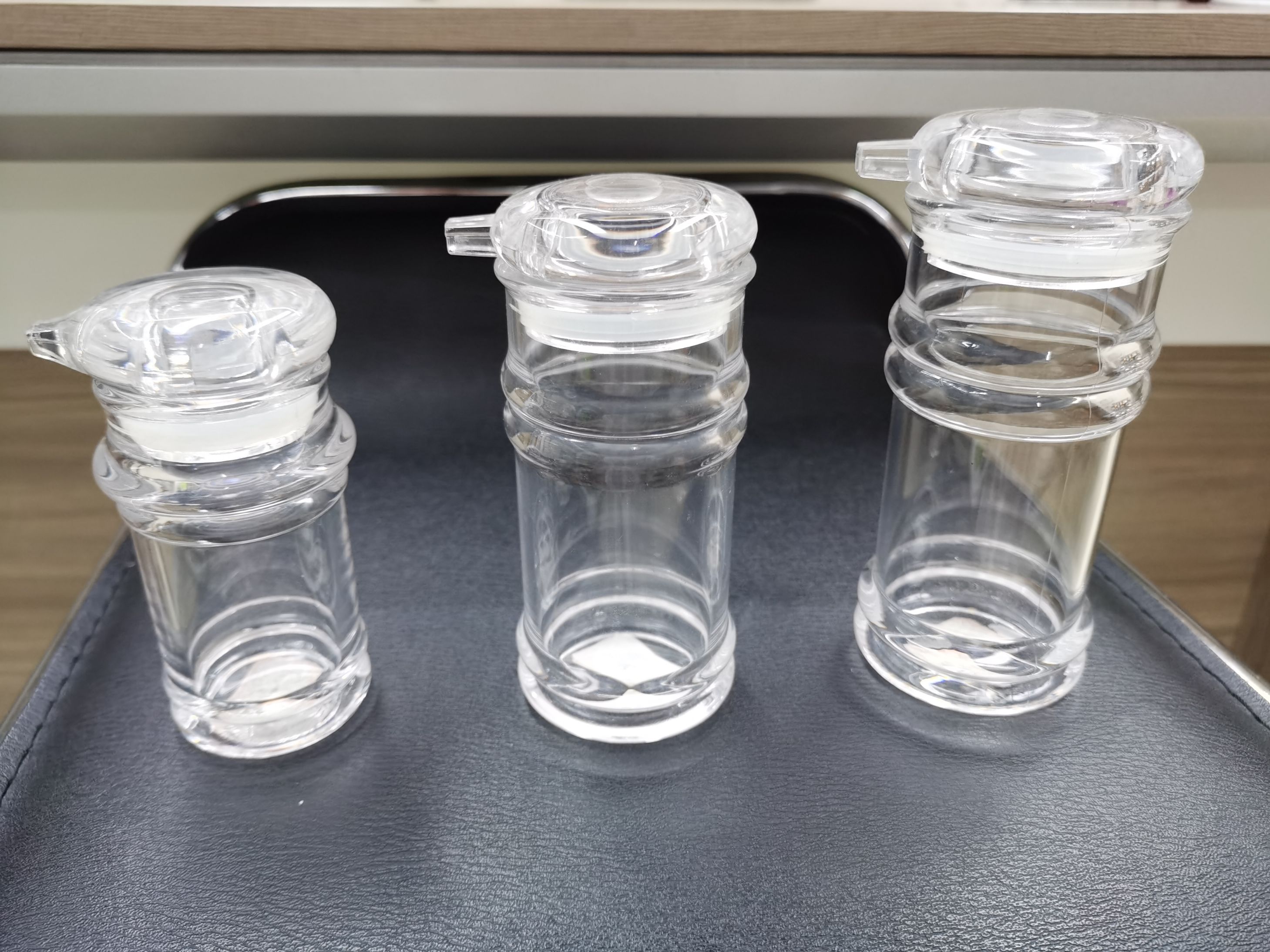 Plastic acrylic oil cans and bottles