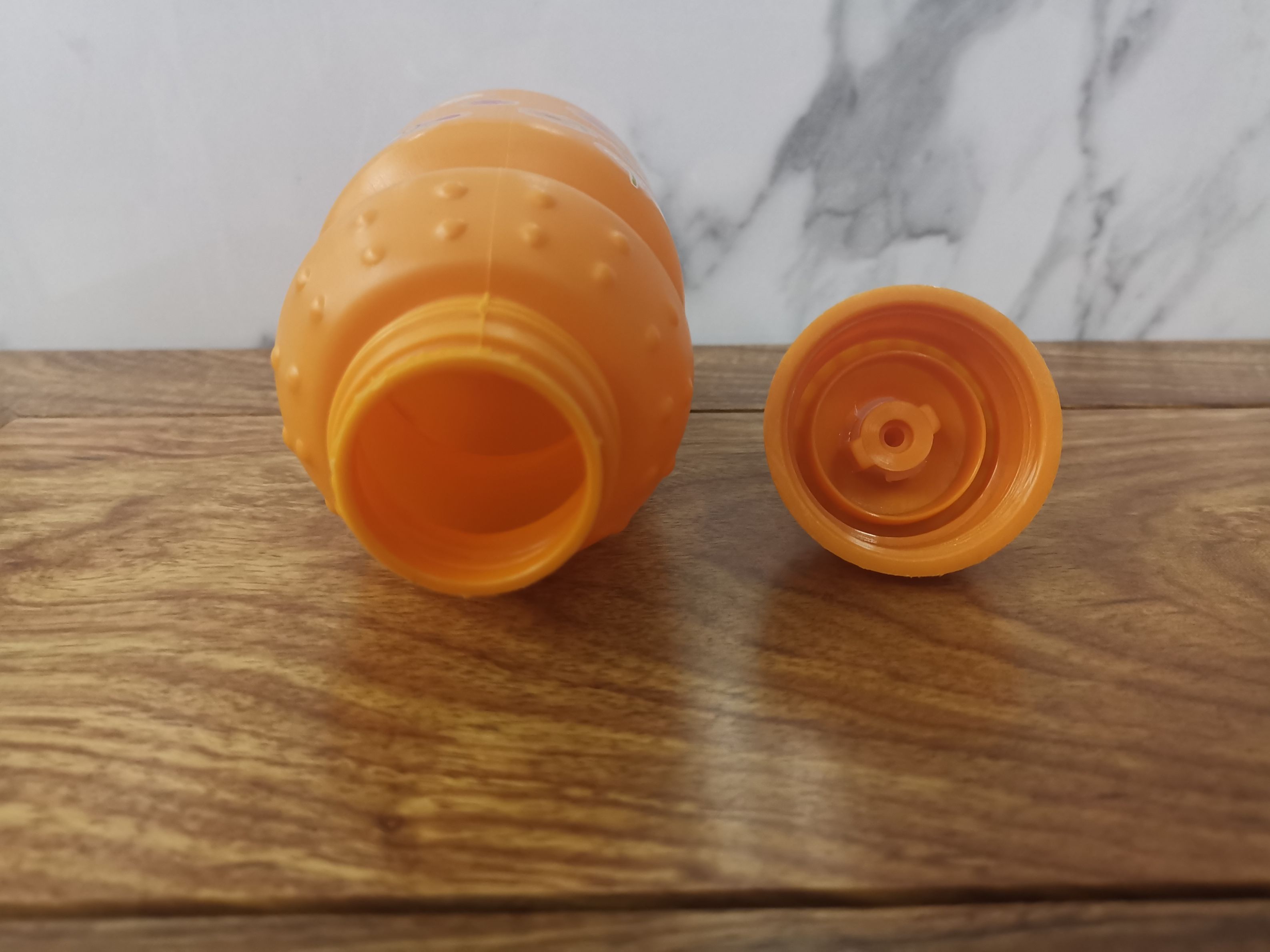 Foreign trade special children's water bottle plastic drinking bottle one open cover water bottle owner recommends children's orange kettle full figure