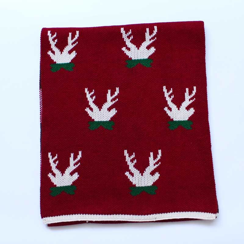 Woman dressed elegantly with Christmas Deer Knit Scarf