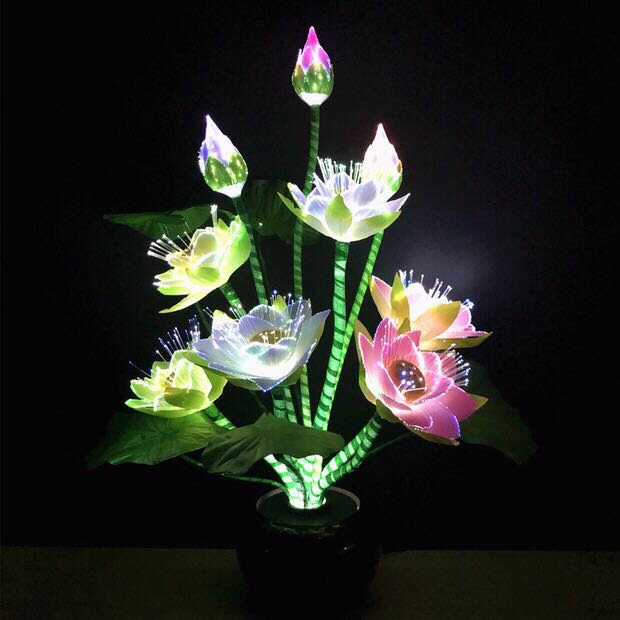 Nine fiber optic LED lotus lamps, plug-in household lotus lamps, are offered before the Buddha Application Scenario