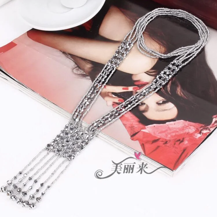 The woven necklace lays T107