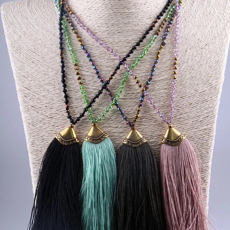 The tassel necklace lays T120 thumbnail