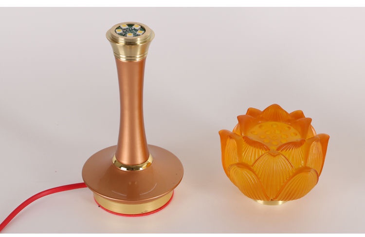 A 10-inch LED lotus lamp, a glazed lotus lamp, is offered in front of the Buddha. It is a long-lasting lamp for the Buddha undefined